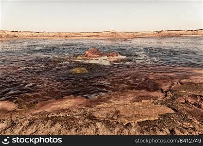 in danakil ethiopia africa the black lake with boiling oil and hot