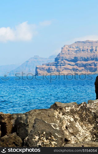 in europe greece santorini island hill and rocks on the summertime beach