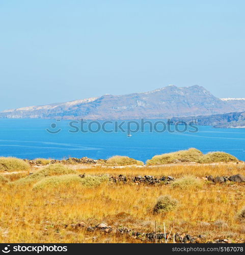 in europe greece santorini island hill and rocks on the summertime beach