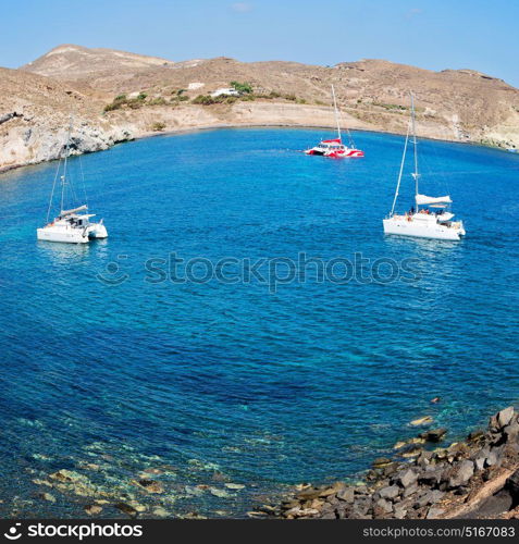 in europe greece santorini island hill and rocks on the summertime beach