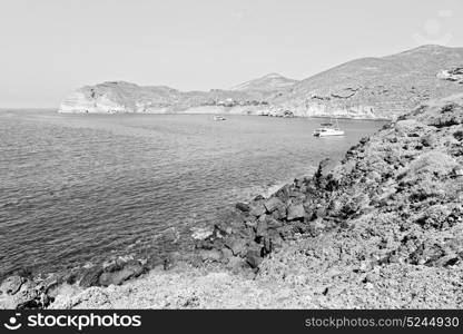 in europe greece santorini island hill and rocks on the summertime beach