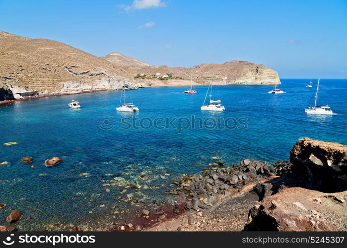 in europe greece santorini island hill and rocks on the summertime beach