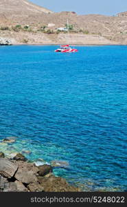 in europe greece santorini island hill and rocks on the summertime beach