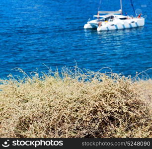 in europe greece santorini island hill and rocks on the summertime beach