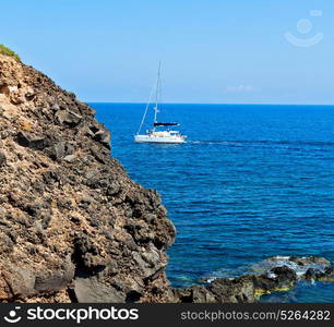 in europe greece santorini island hill and rocks on the summertime beach