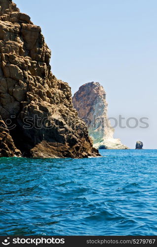 in europe greece santorini island hill and rocks on the summertime beach