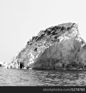 in europe greece santorini island hill and rocks on the summertime beach