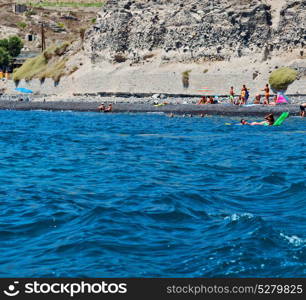 in europe greece santorini island hill and rocks on the summertime beach