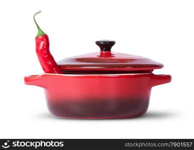In front red chili pepper in saucepan with lid isolated on white background