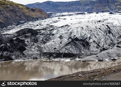 in Iceland. travel to Iceland - Solheimajokull glacier (South glacial tongue of Myrdalsjokull ice cap) in Katla Geopark on Icelandic Atlantic South Coast in september