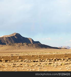 in iran blur mountain and landscape from the window of a car