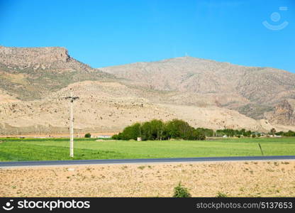 in iran blur mountain and landscape from the window of a car