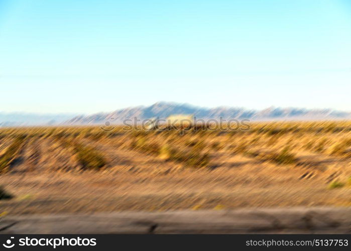 in iran blur mountain and landscape from the window of a car