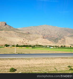 in iran blur mountain and landscape from the window of a car