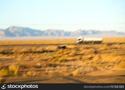 in iran blur mountain and landscape from the window of a car