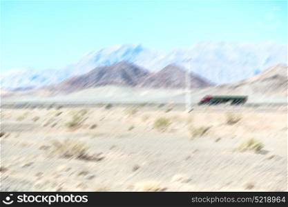 in iran blur mountain and landscape from the window of a car