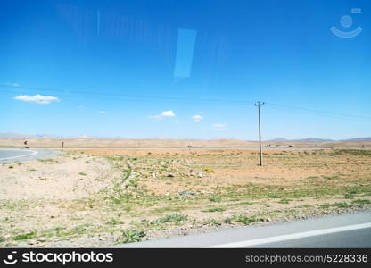 in iran blur mountain and landscape from the window of a car