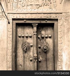 in iran old door near the mosque and antique construction