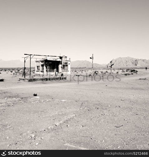 in iran old gas station the desert mountain background and nobody