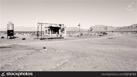 in iran old gas station the desert mountain background and nobody