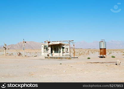 in iran old gas station the desert mountain background and nobody