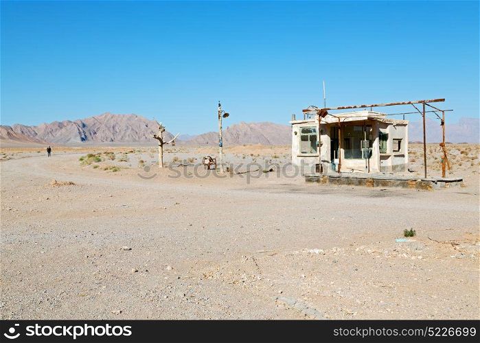 in iran old gas station the desert mountain background and nobody