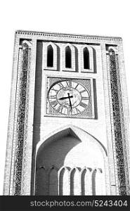 in iran old yazd city and the antique brick clock tower near the sky