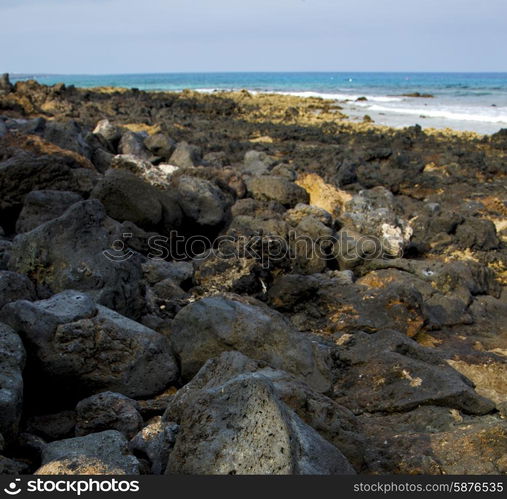 in lanzarote isle foam rock spain landscape stone sky cloud beach water &#xA;