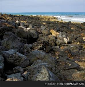in lanzarote isle foam rock spain landscape stone sky cloud beach water &#xA;