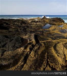 in lanzarote spain rock stone sky cloud beach water musk pond coastline and summer &#xA;