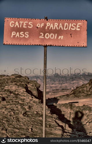 in lesotho road sign gate of paradise pass mountain destination