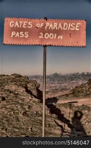in lesotho road sign gate of paradise pass mountain destination