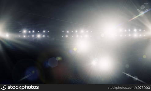 In lights of stage. Background image with defocused blurred stage lights