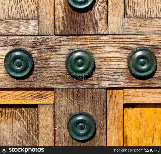 in london antique brown door rusty brass nail and light