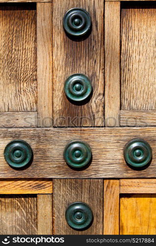 in london antique brown door rusty brass nail and light