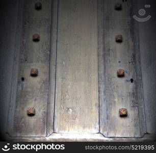 in london antique brown door rusty brass nail and light