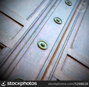 in london antique brown door rusty brass nail and light