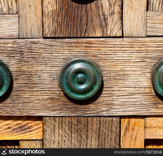 in london antique brown door rusty brass nail and light