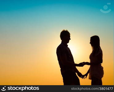 In love young couple enjoying the sunset together, beautiful evening in archipelago