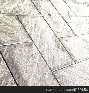 in mozzate street lombardy italy varese abstract pavement of a curch and marble