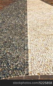 in mozzate street lombardy italy varese abstract pavement of a curch and marble