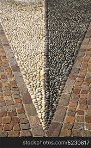 in mozzate street lombardy italy varese abstract pavement of a curch and marble