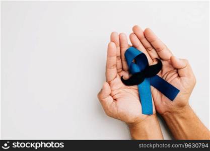 In November, men&rsquo;s health and Prostate cancer awareness take center stage. Man&rsquo;s hands embrace a light blue ribbon with a mustache on a blue background a symbol of support.