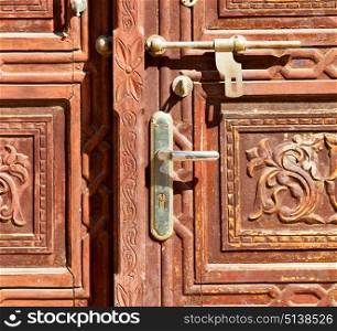 in oman antique door entrance and decorative handle for background