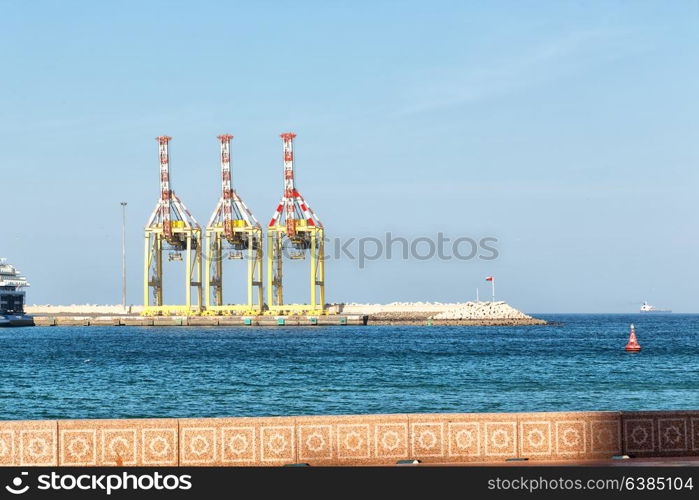 in oman muscar the port and the crane in the harbor near the sky