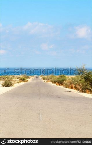 in oman old asphalt road near the coastline