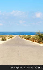 in oman old asphalt road near the coastline