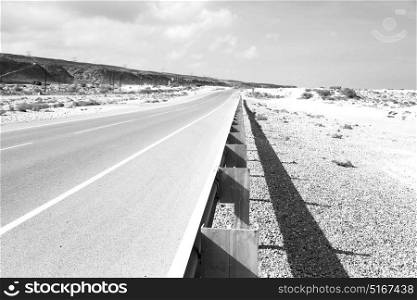 in oman old asphalt road near the coastline