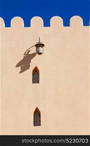 in oman the street lamp in a old wall