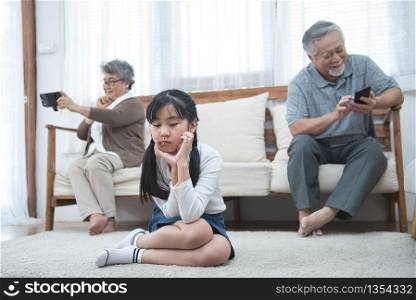In quarrel elderly mother grown up daughter sit on couch separately having conflict, intergenerational misunderstanding, adult grandchild grandma difficult bad relations different generations concept